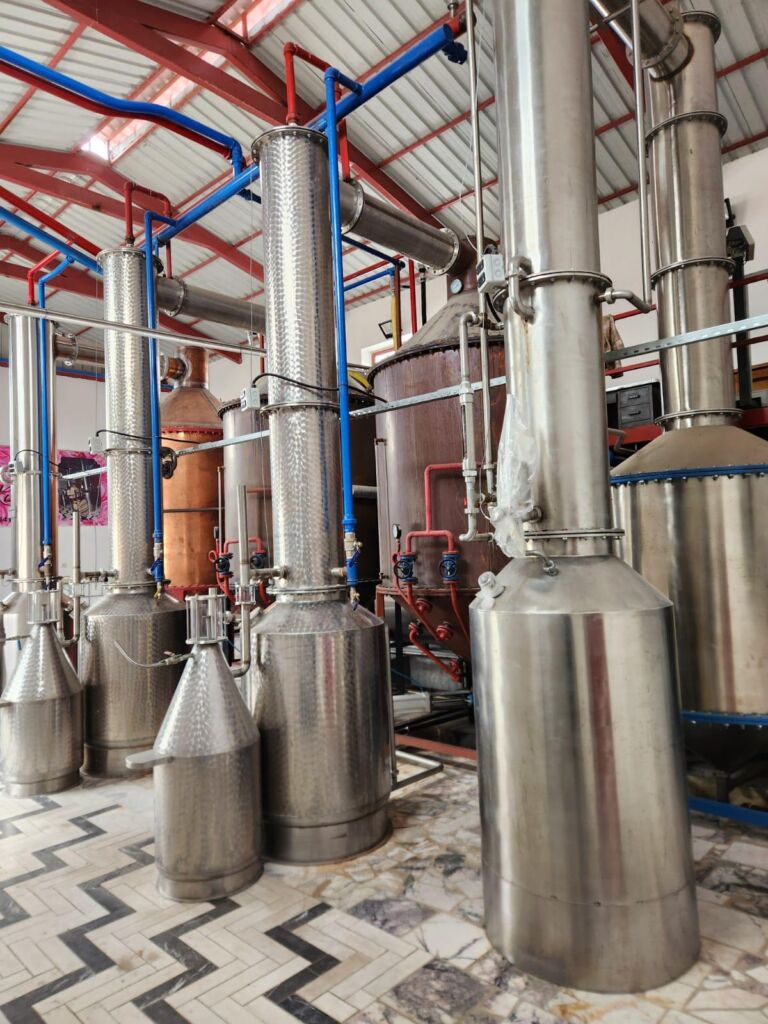 Stainless steel rose oil distillation columns inside TheRosa production facility