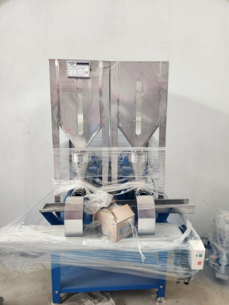 Industrial filling and weighing machine used for rose oil and hydrosol packaging